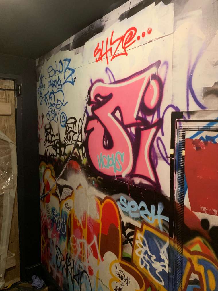 Graffiti wallpaper hanging in a club in Bournemouth - Emerald Painters Portfolio