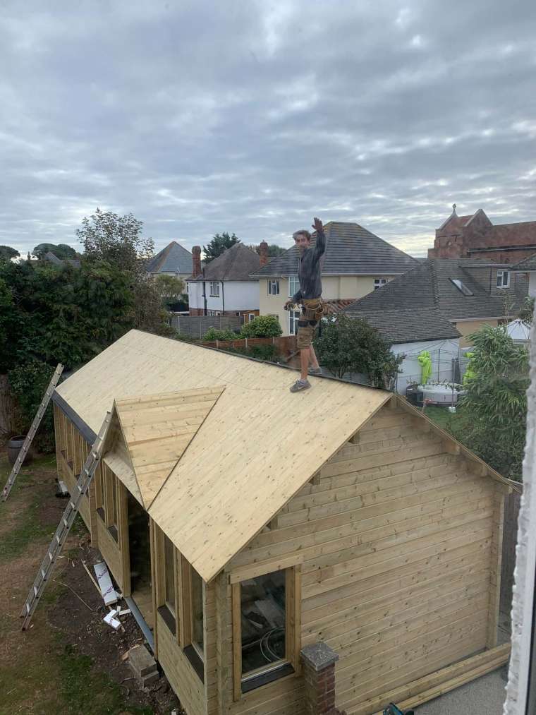 Emerald Office Headquarters Log Cabin Building Bournemouth - Working on the Roof