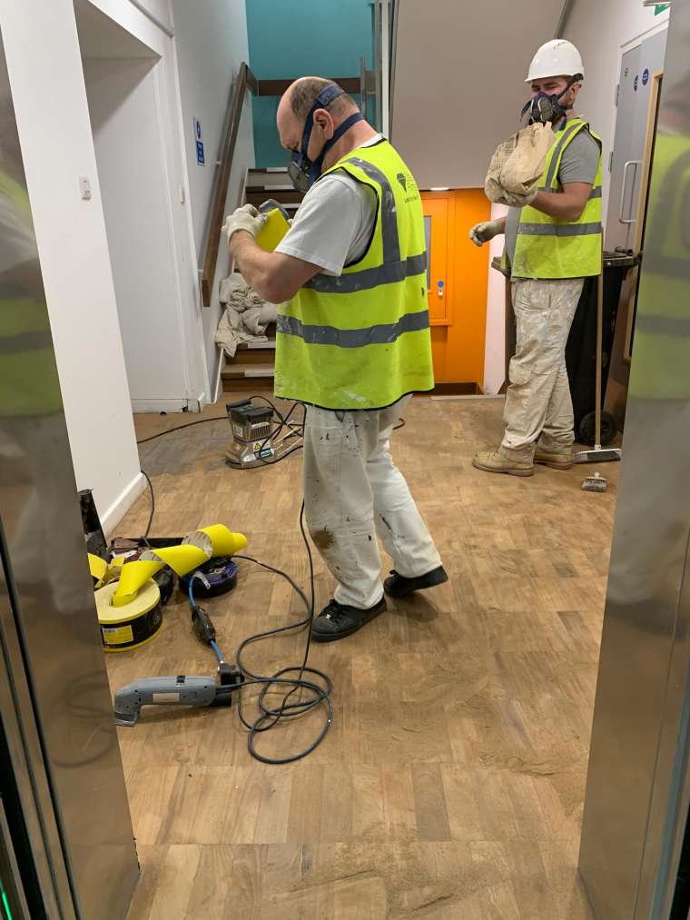 Southampton University - Restoration of Parquet Flooring with Intumescent Varnish - In Progress - Emerald Painters Portfolio